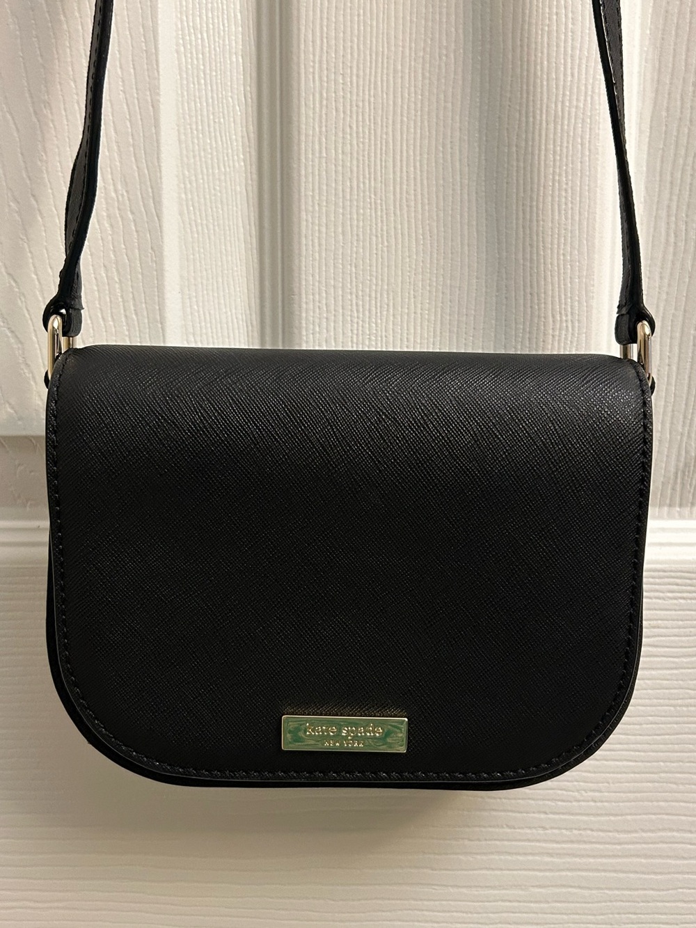 kate spade black leather crossbody with gold plaque